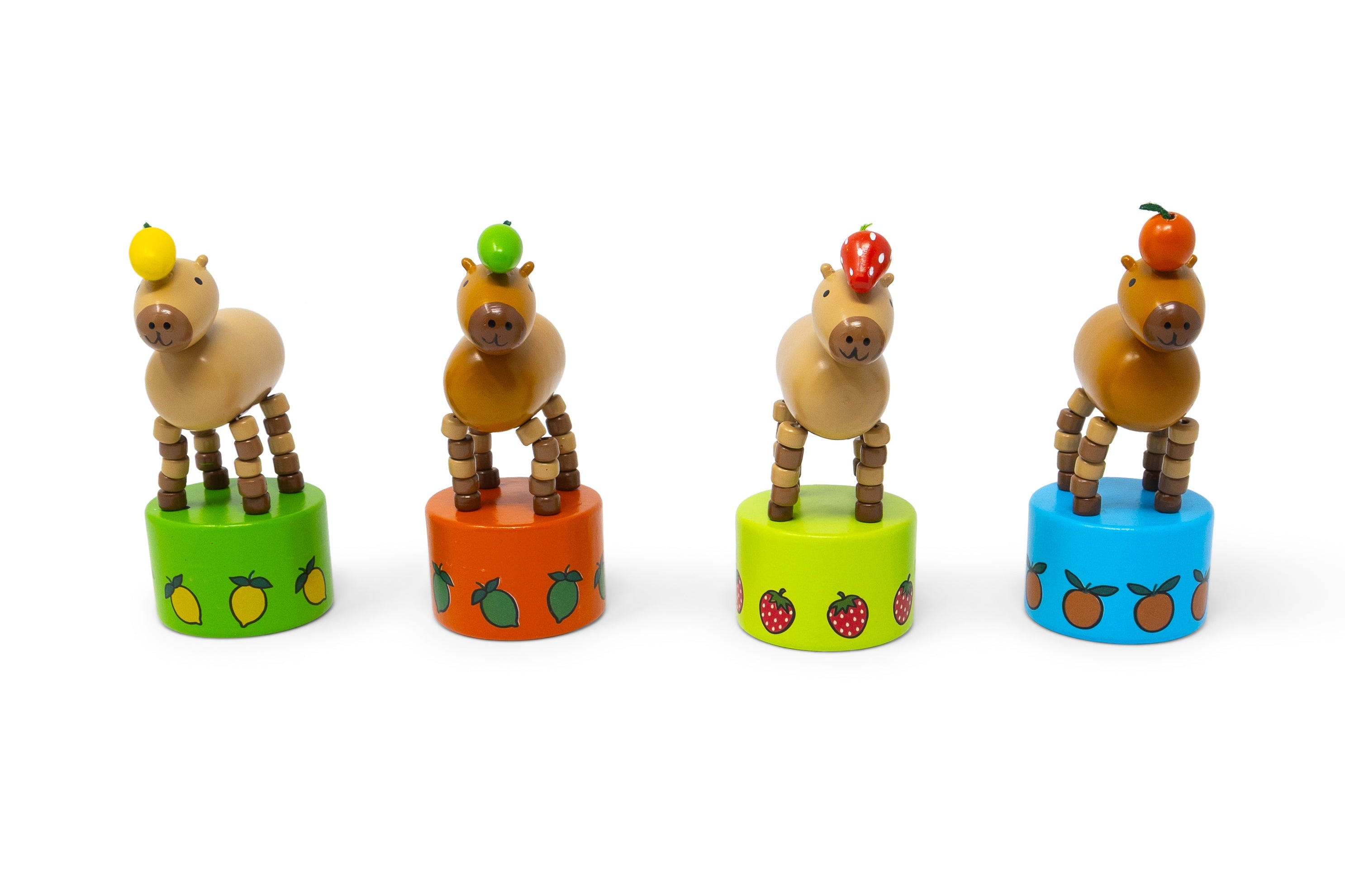 Set of wooden animal toys on colorful cylindrical stands with fruit designs on a white background